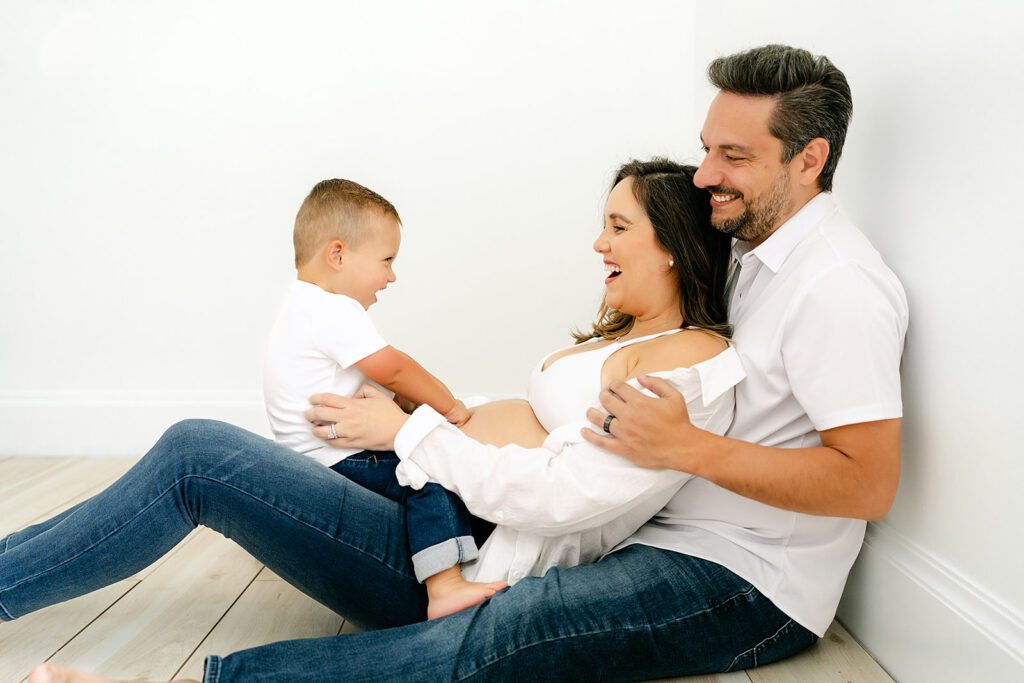 mom, dad, and toddler boy. maternity photoshoot in studio